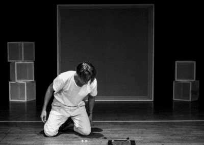 man kneeling while playing a board game